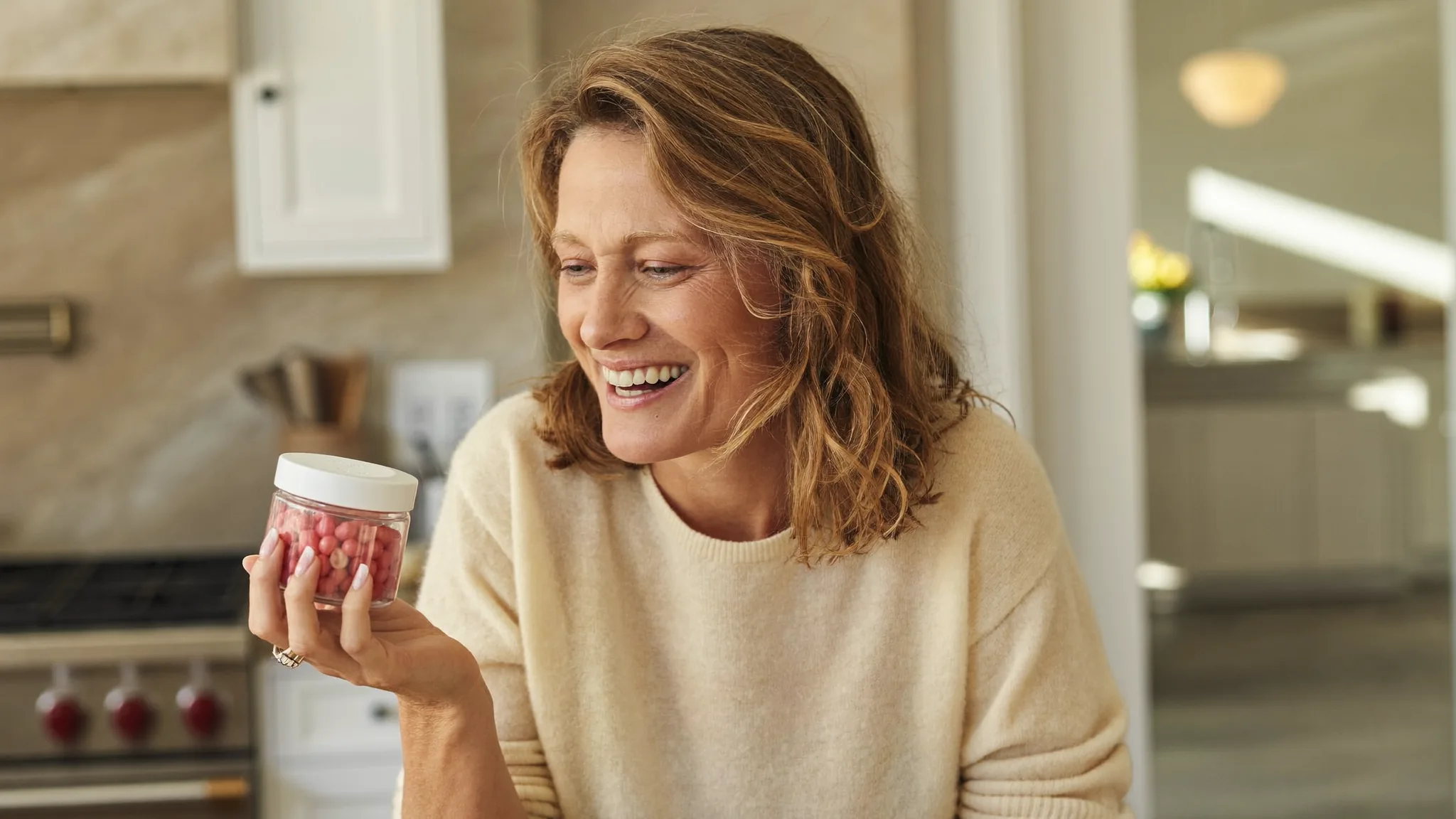 A woman in a bright kitchen